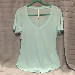 NWT the group by babaton light blue t-shirt medium
